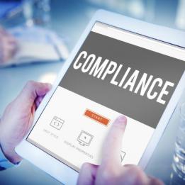 Compliance: a man starts to fill in a compliance questionnaire on a tablet