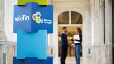Cover of the annual report 2024: 2 people talking aside the Wikfin logo