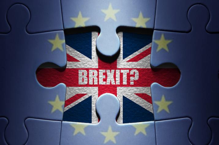 Brexit: a puzzle of the flag of the European Union with a missing piece in the middle, instead of which we see the British flag with the word Brexit and a question mark written on it