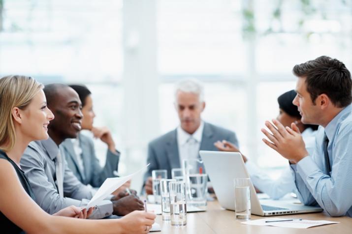 Jobs: a photo of a meeting where several attendees are engaged in discussion