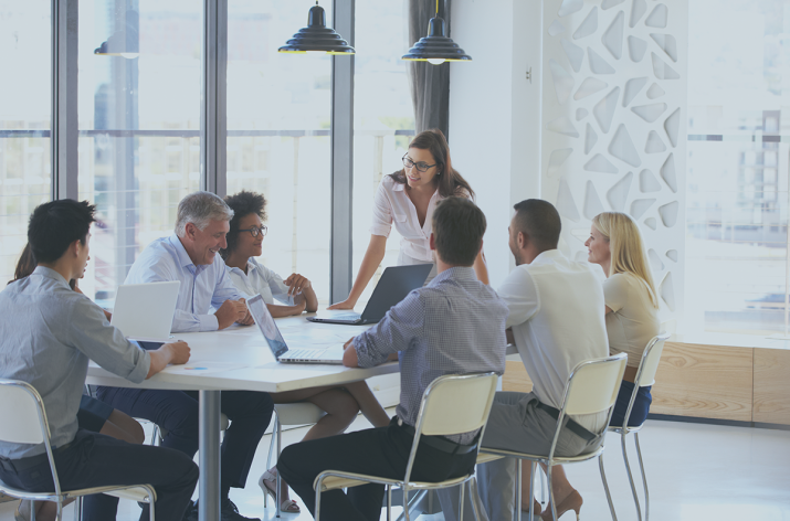 Jobs: a photo of a meeting where someone is standing up and giving explanations